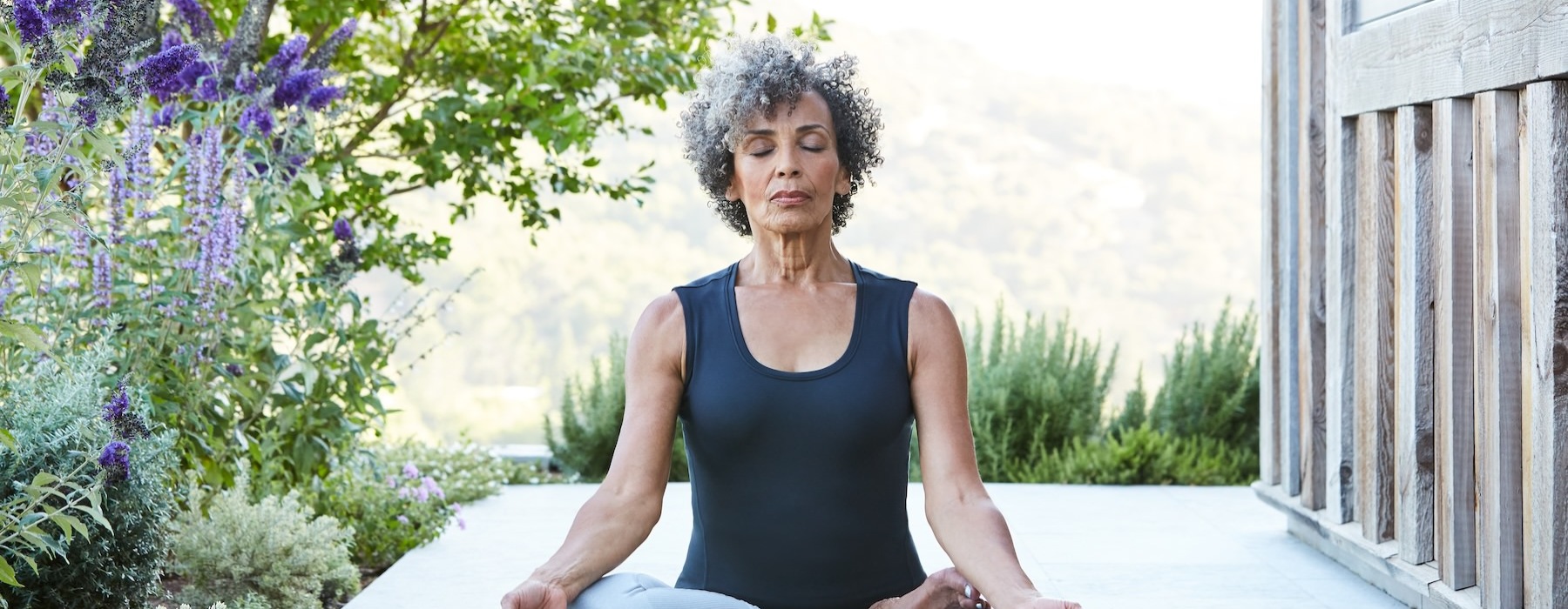woman doing yoga on a porch