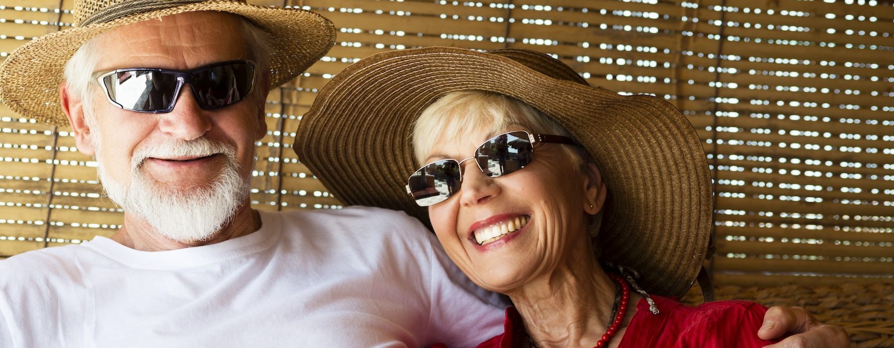 a man and woman wearing hats