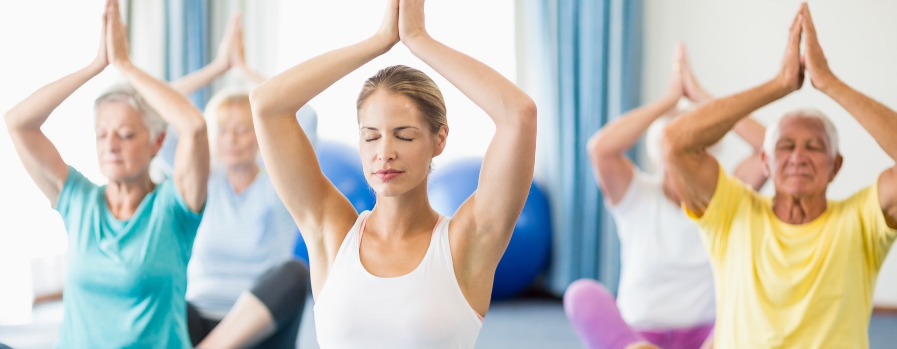a group of people doing yoga